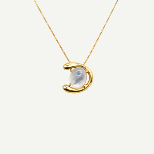 Gold necklace with a half-moon pendant and nacre gemstone on a white background