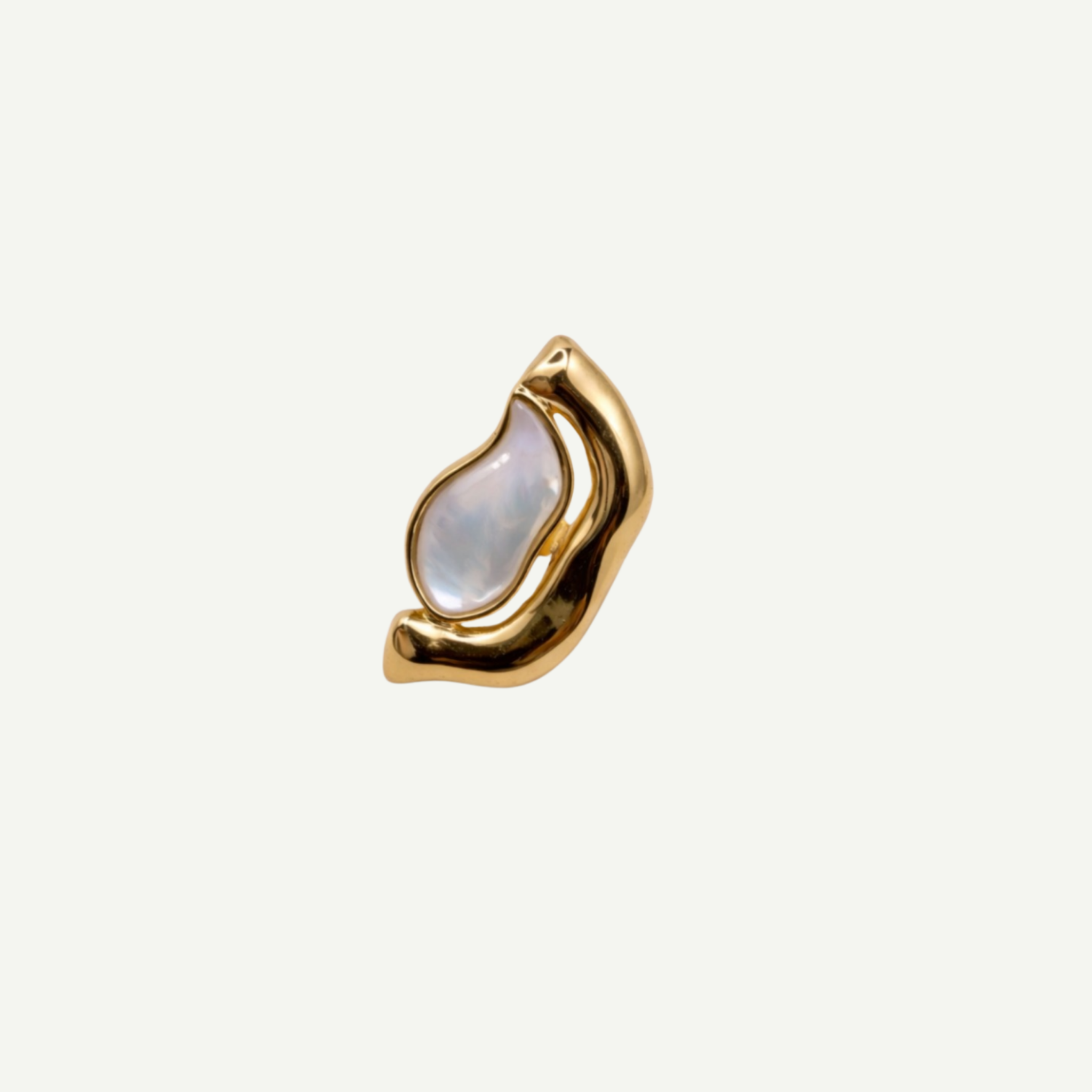Gold ring with a mother-of-pearl gemstone on a white background
