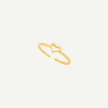 Gold ring with a heart design on a light gray background