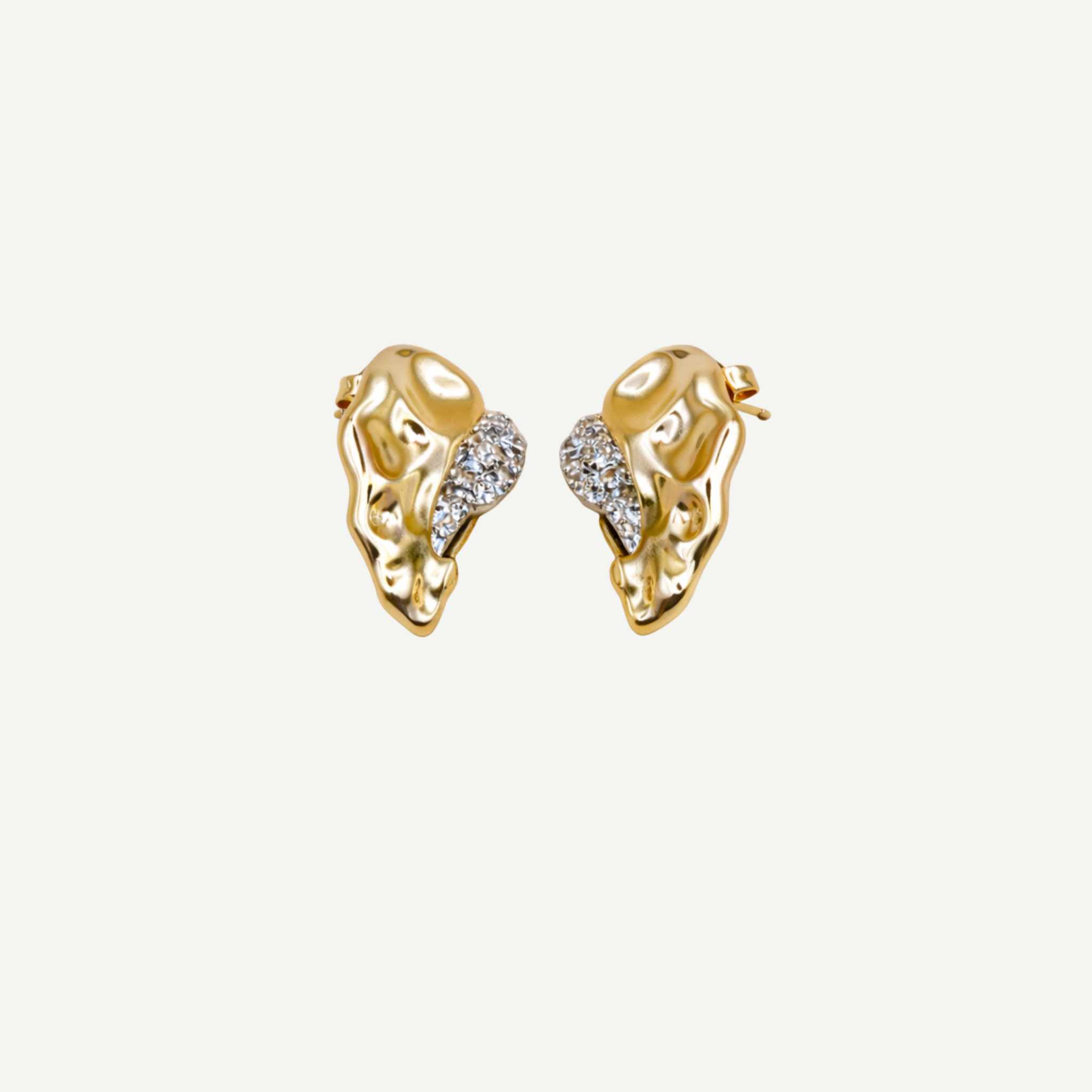 Pair of gold hoop earrings on a light beige background
