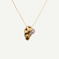 Gold necklace with a unique pendant on a white background