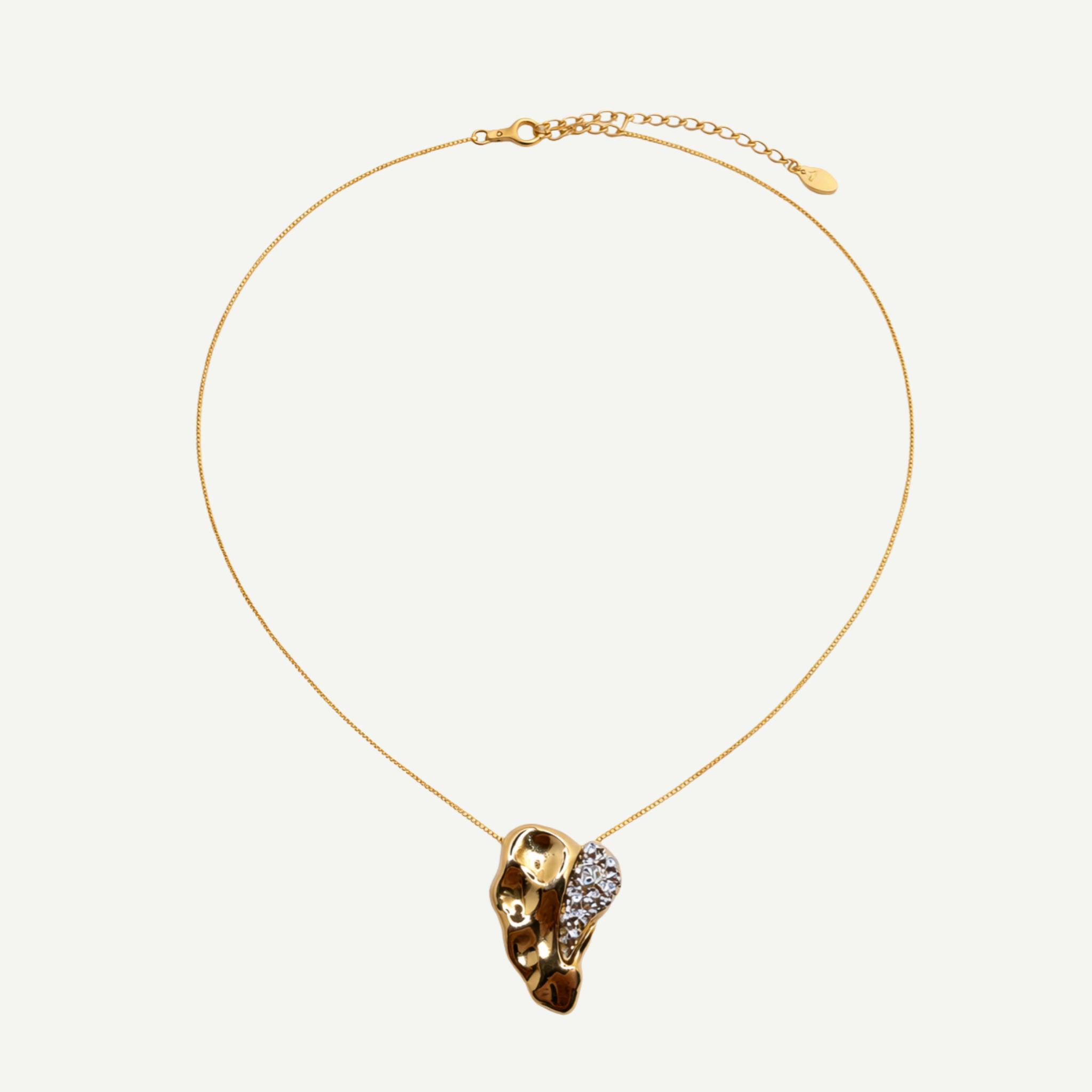 Gold necklace with a unique pendant on a white background