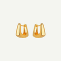 Pair of gold hoop earrings on a white background