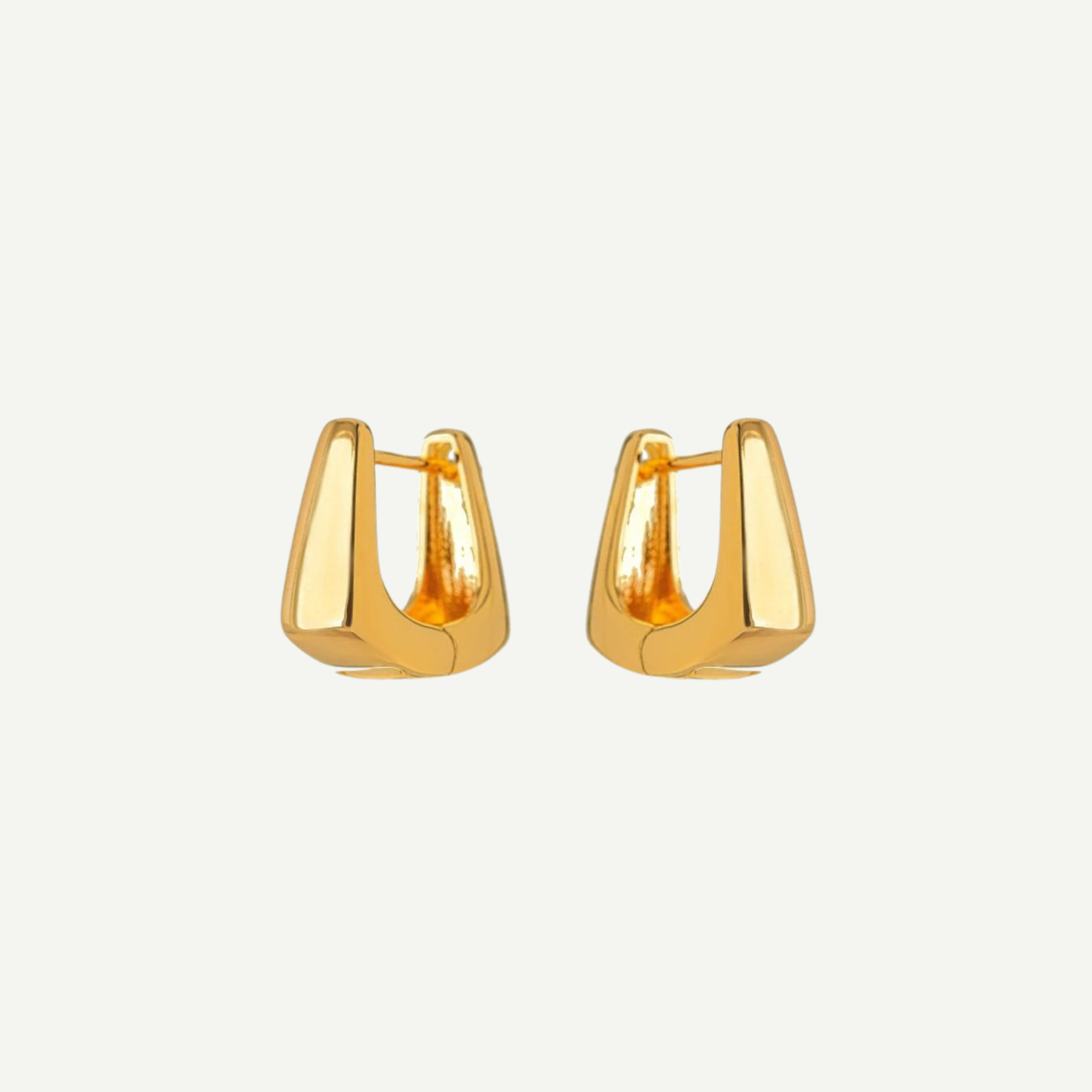Pair of gold hoop earrings on a white background