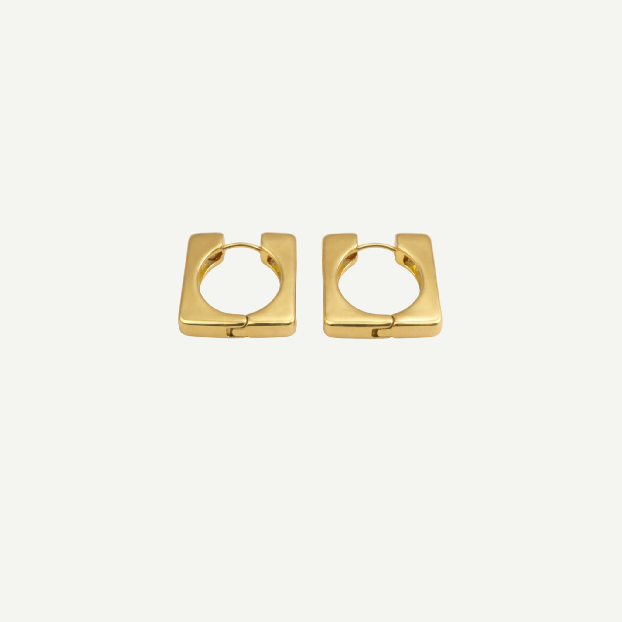 Pair of gold hoop rectangular earrings on a white background