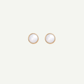 Pair of gold earrings with nacre gemstones on a light gray background
