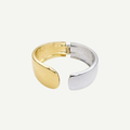 Two-toned gold and silver ring on a white background