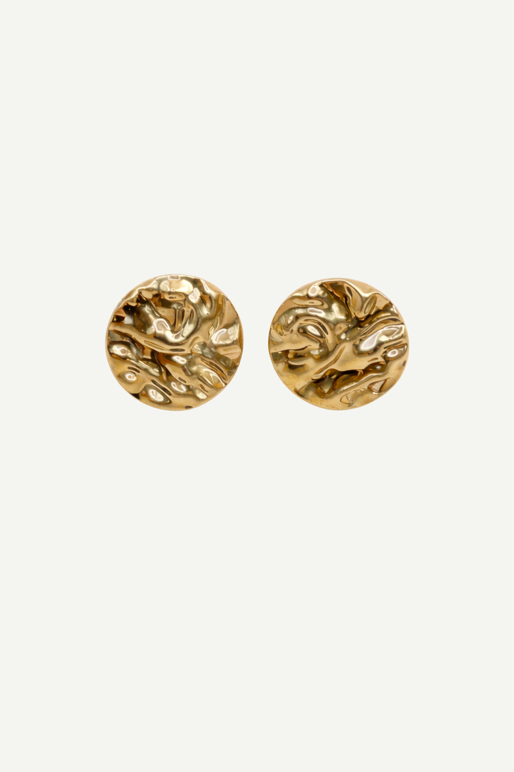 Pair of gold round textured earrings on a white background