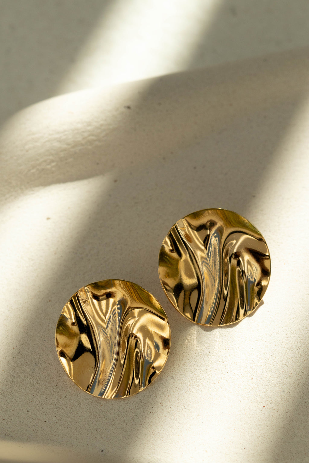 Textured Gold Disc Stud Earrings in organic background