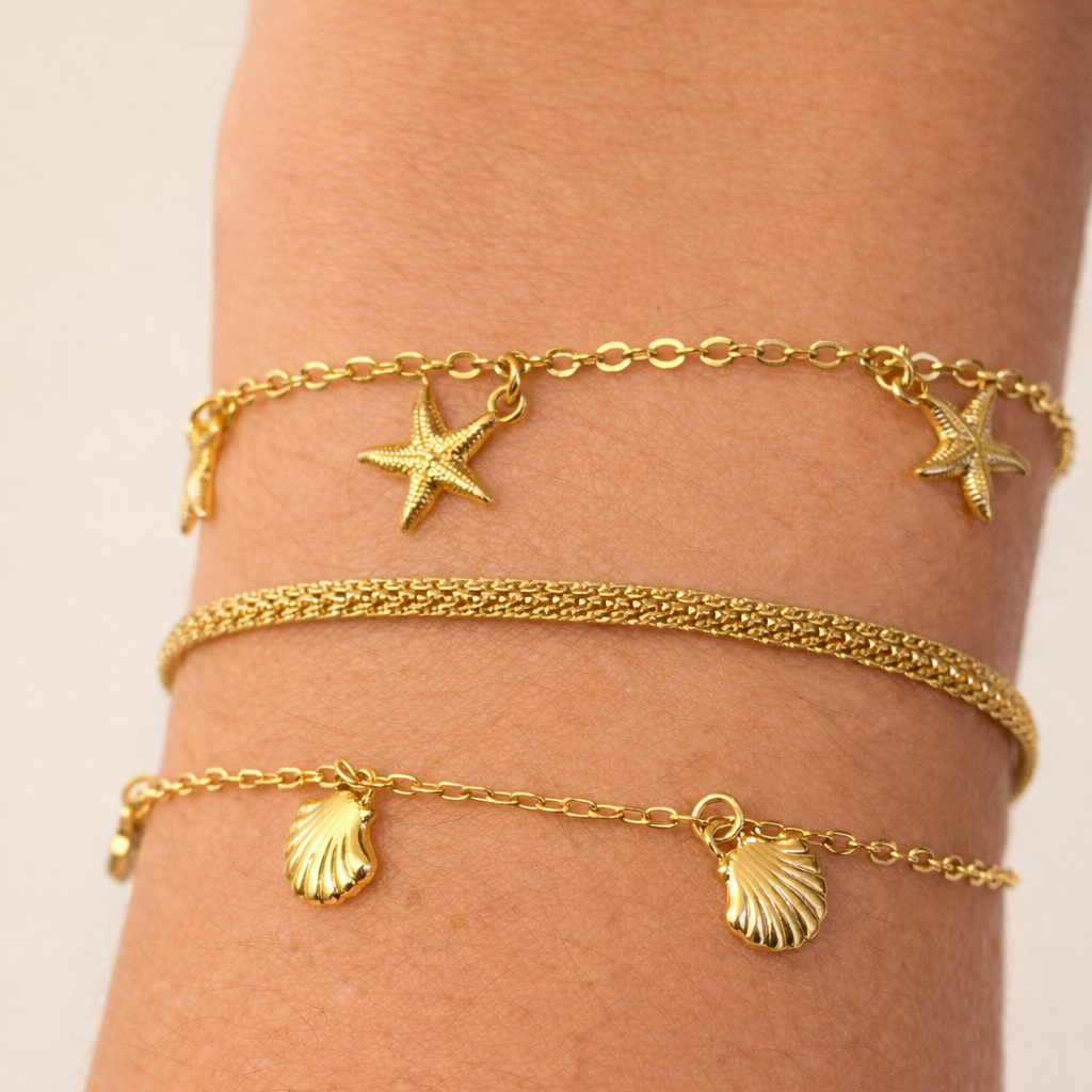 3 bracelets on a wrist
